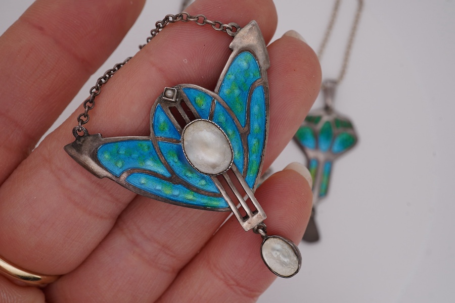 An Edwardian Art Nouveau silver and enamel drop pendant, by Charles Horner, Chester, 1908, 46mm, on a later 925 chain, together with one other Art Nouveau white metal, enamelled and mother of pearl set pendant necklace a